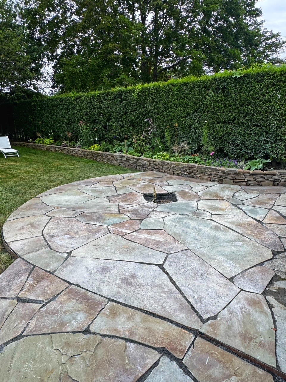 Flagstone with stone wall