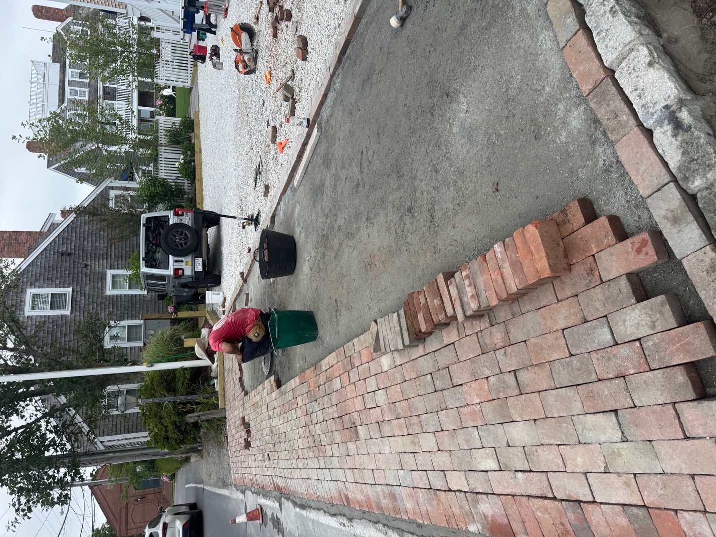 Worker installing pavers